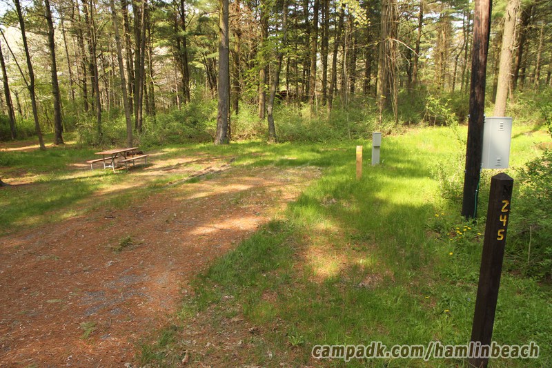 Campsite Photo of Site 245 at Hamlin Beach State Park, New York - Looking at Site from Road Sign Visible