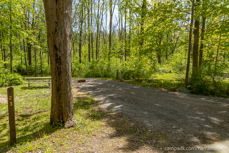 Campsite Photo of Site 23 at Hamlin Beach State Park, New York - Looking at Site from Road Sign Visible