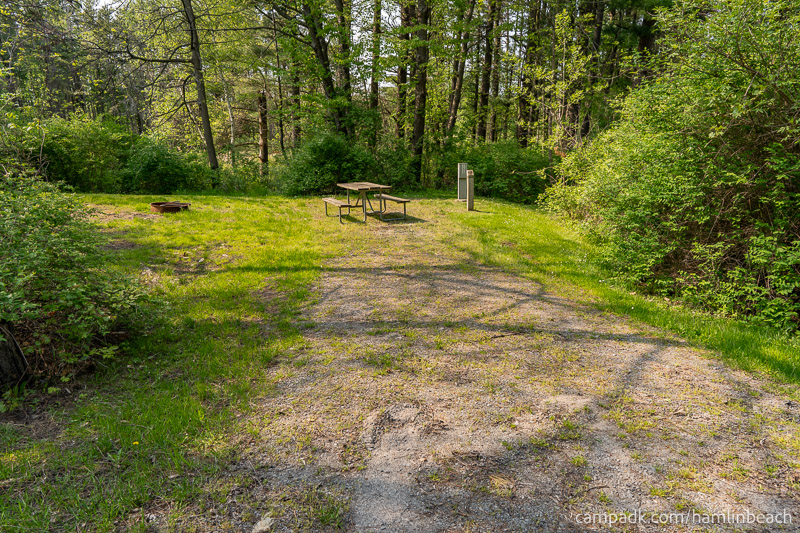 Campsite Photo of Site 253 at Hamlin Beach State Park, New York - Looking at Site from Road Sign Visible