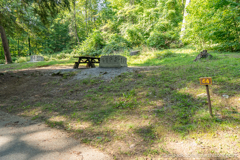 Campsite Photo of Site 64 at Hearthstone Point Campground, New York - Looking at Site from Road Sign Visible