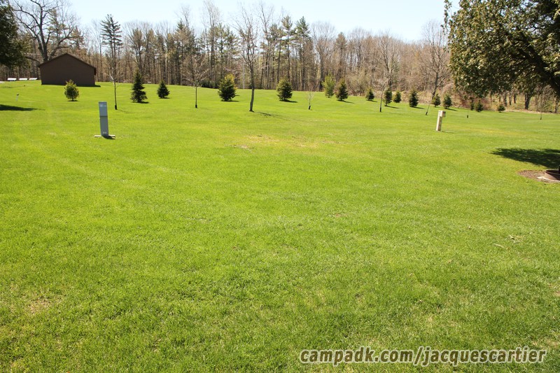 Campsite Photo of Site 101 at Jacques Cartier State Park, New York - Looking at Site from Road Sign Visible