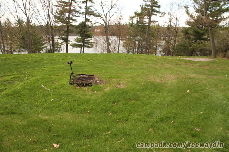 Campsite Photo of Site 15 at Keewaydin State Park, New York - Looking at Site from Road Sign Visible