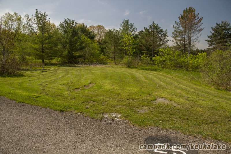 Campsite Photo of Site 90 at Keuka Lake State Park, New York - Looking at Site from Road Sign Visible