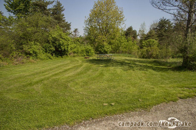 Campsite Photo of Site 70 at Keuka Lake State Park, New York - Looking at Site from Road Sign Visible