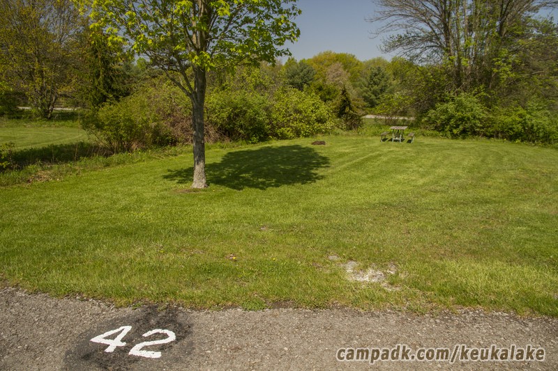 Campsite Photo of Site 75 at Keuka Lake State Park, New York - Looking at Site from Road Sign Visible
