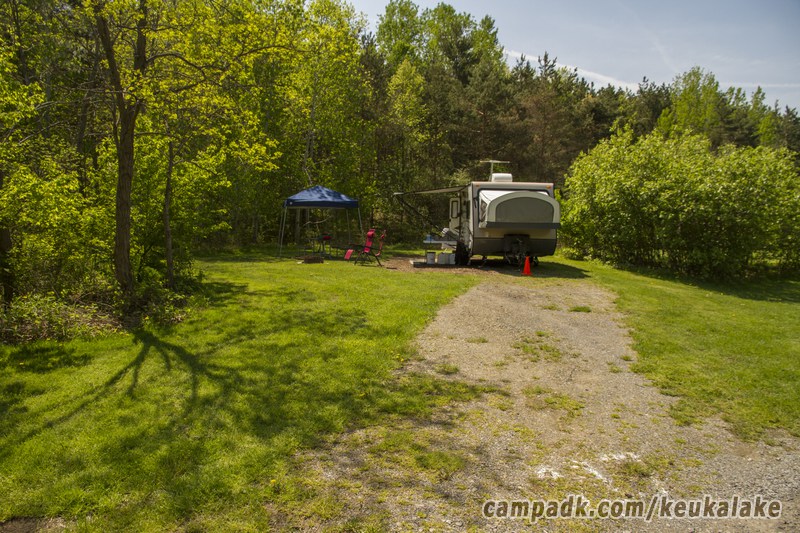 Campsite Photo of Site 110 at Keuka Lake State Park, New York - Looking at Site from Road Sign Visible