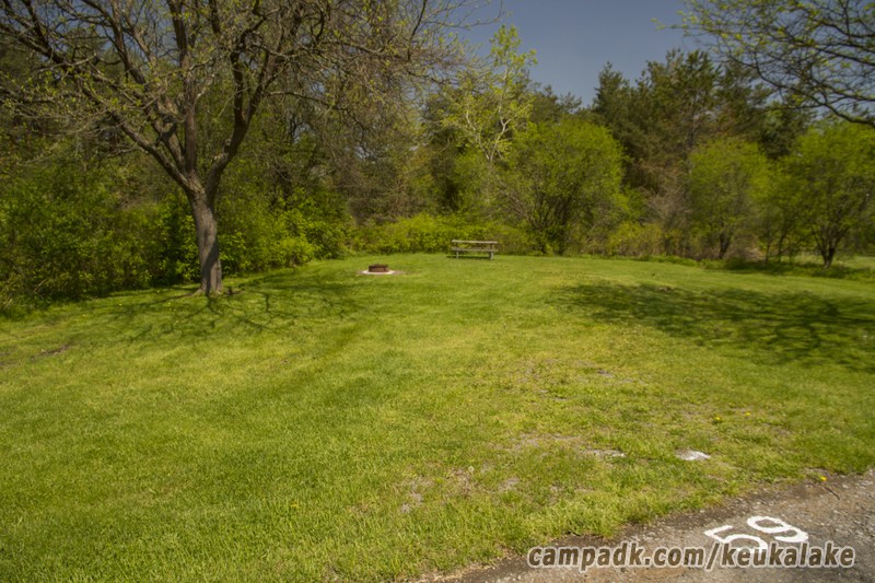 Campsite Photo of Site 5 at Keuka Lake State Park, New York - Looking at Site from Road Sign Visible
