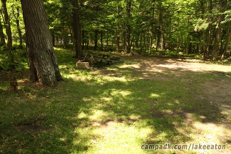 Campsite Photo of Site 115 at Lake Eaton Campground, New York - Looking at Site from Road Sign Visible