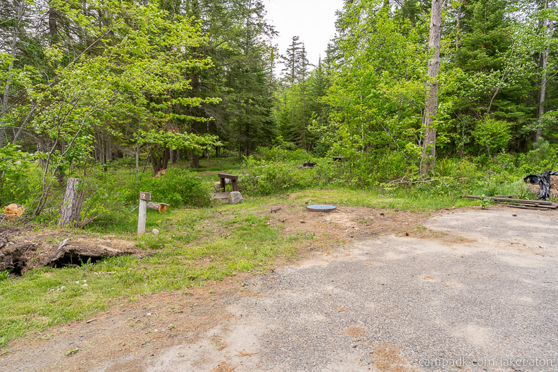 Campsite Photo of Site 7 at Lake Eaton Campground, New York - Looking at Site from Road Sign Visible