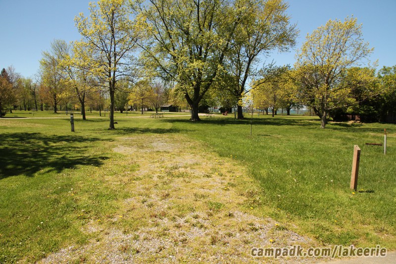 Campsite Photo of Site 33 at Lake Erie State Park, New York - Looking at Site from Road Sign Visible