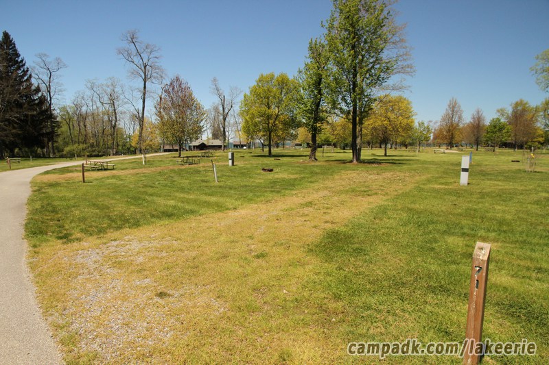 Campsite Photo of Site 71 at Lake Erie State Park, New York - Looking at Site from Road Sign Visible