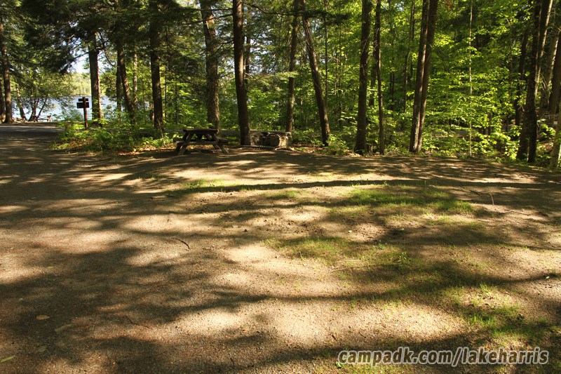 Campsite Photo of Site 15 at Lake Harris Campground, New York - Looking at Site from Road Sign Visible