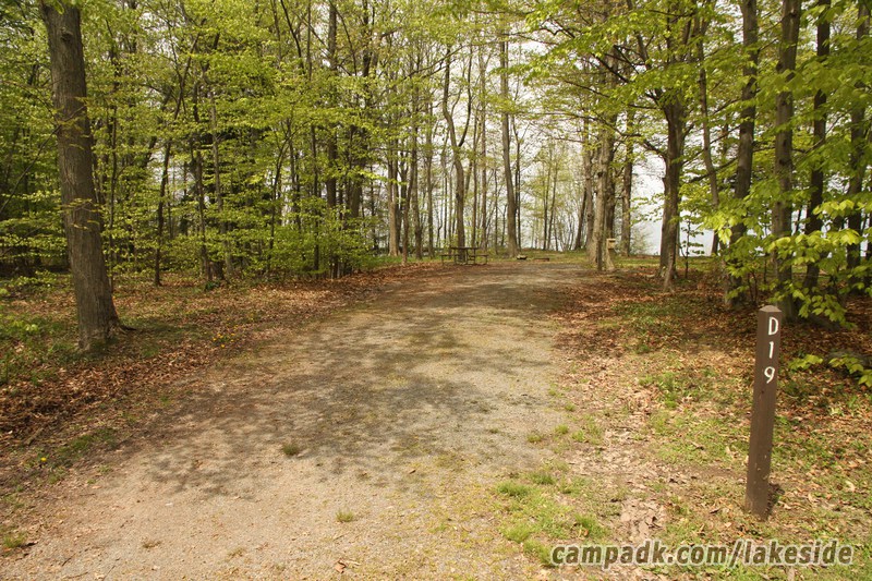 Campsite Photo of Site D19 at Lakeside State Park, New York - Looking at Site from Road Sign Visible