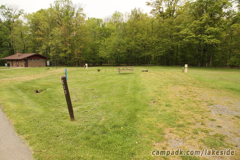 Campsite Photo of Site E13 at Lakeside State Park, New York - Looking at Site from Road Sign Visible