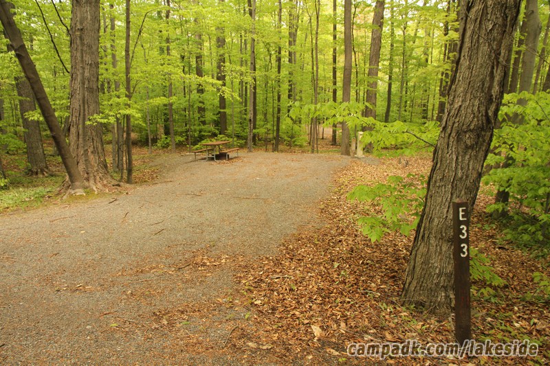 Campsite Photo of Site E33 at Lakeside State Park, New York - Looking at Site from Road Sign Visible