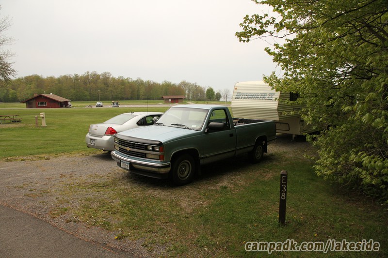 Campsite Photo of Site E38 at Lakeside State Park, New York - Looking at Site from Road Sign Visible