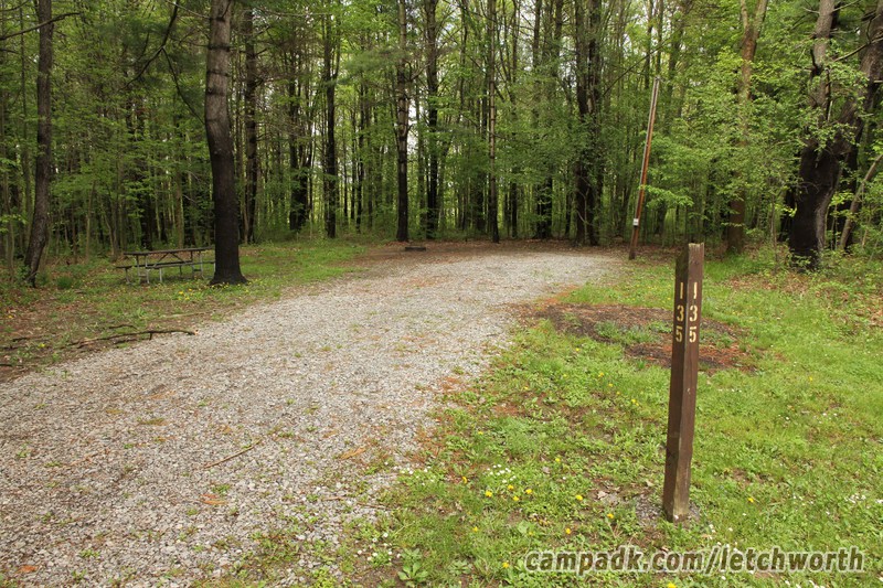 Campsite Photo of Site 135 at Letchworth State Park, New York - Looking at Site from Road Sign Visible