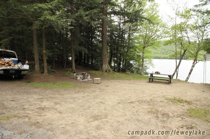 Campsite Photo of Site 95 at Lewey Lake Campground, New York - Looking at Site from Road Sign Visible