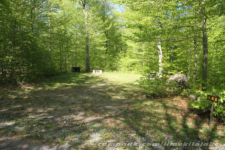 Campsite Photo of Site 148 at Limekiln Lake Campground, New York - Looking at Site from Road Sign Visible