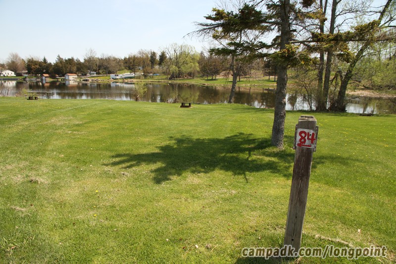 Campsite Photo of Site 84 at Long Point State Park, New York - Looking at Site from Road Sign Visible