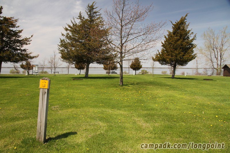 Campsite Photo of Site 20 at Long Point State Park, New York - Looking at Site from Road Sign Visible