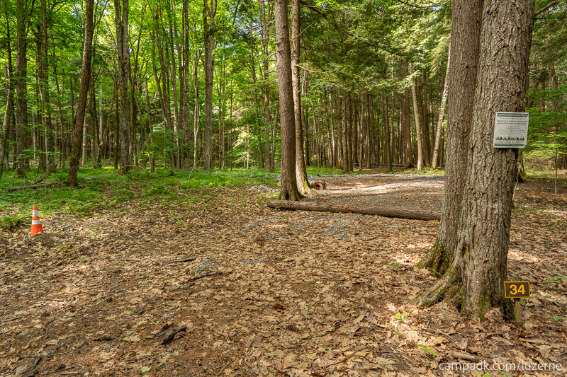 Campsite Photo of Site 34 at Luzerne Campground, New York - Looking at Site from Road Sign Visible