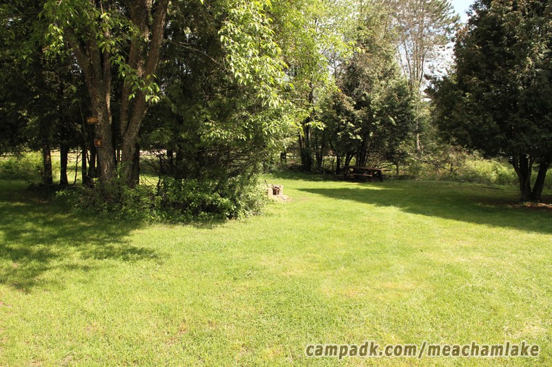 Campsite Photo of Site 4 at Meacham Lake Campground, New York - Looking at Site from Road Sign Visible