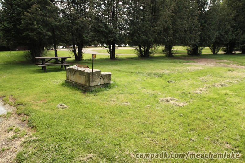 Campsite Photo of Site 49 at Meacham Lake Campground, New York - Looking at Site from Road Sign Visible