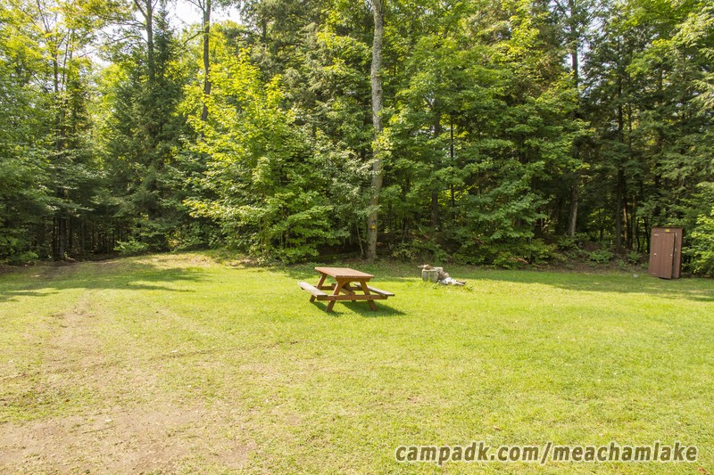 Campsite Photo of Site 180 at Meacham Lake Campground, New York - Looking at Site from Road Sign Visible