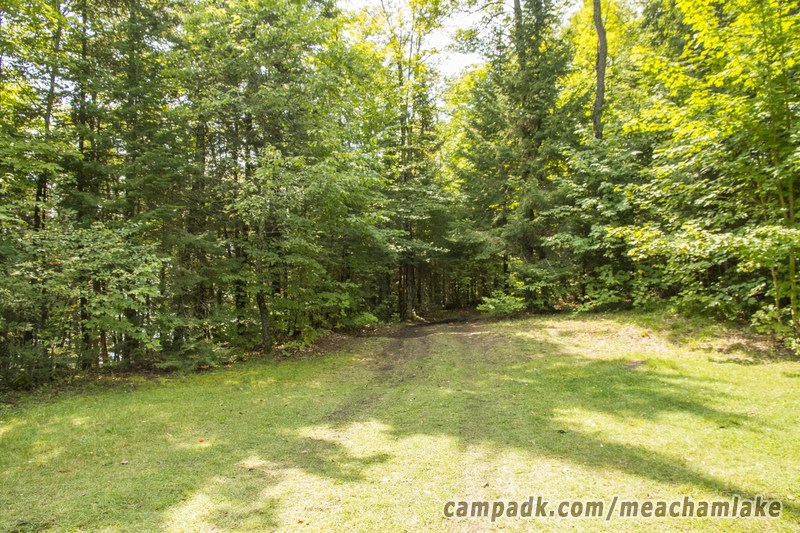 Campsite Photo of Site 181 at Meacham Lake Campground, New York - Looking at Site from Road Sign Visible