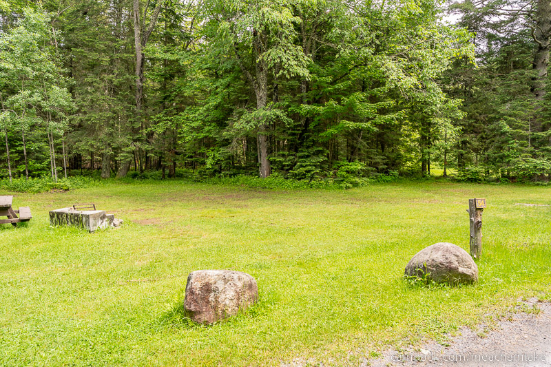 Campsite Photo of Site 54 at Meacham Lake Campground, New York - Looking at Site from Road Sign Visible