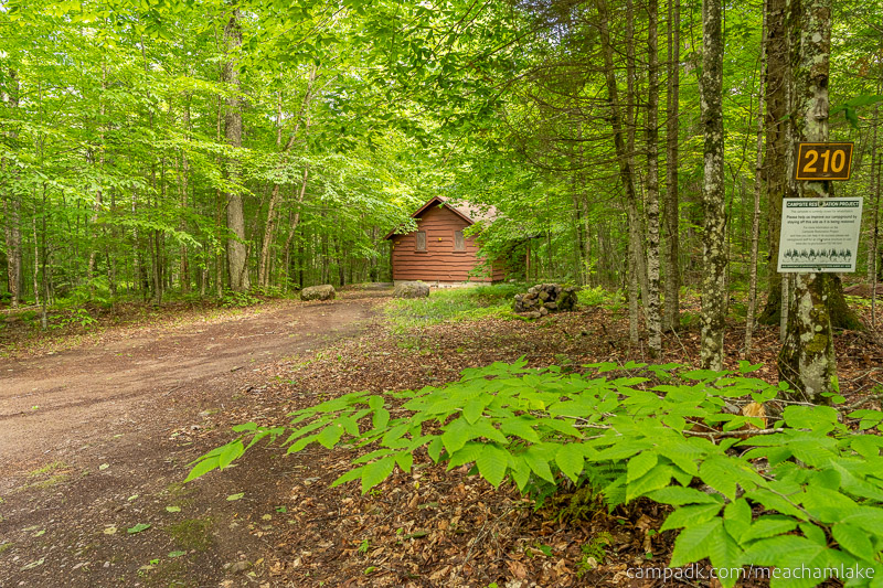 Campsite Photo of Site 210 at Meacham Lake Campground, New York - Looking at Site from Road Sign Visible
