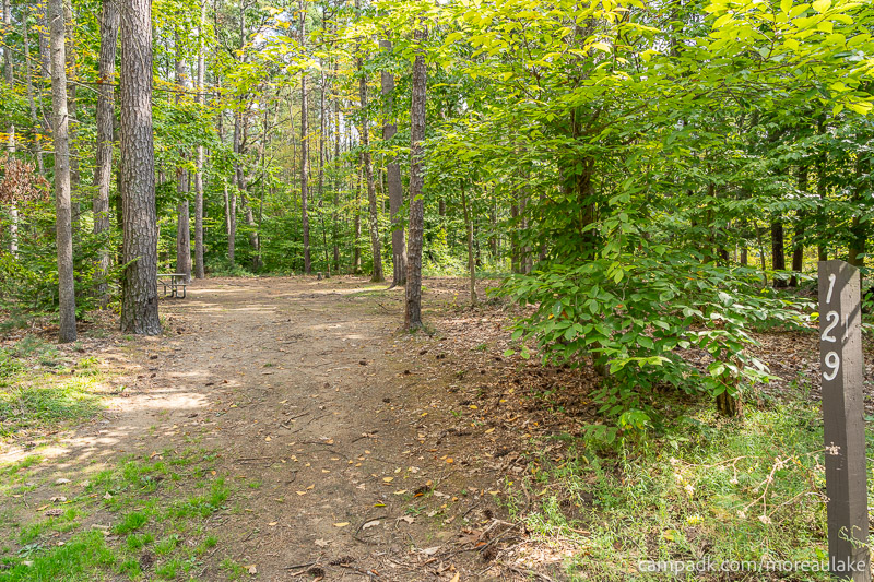 Campsite Photo of Site 129 at Moreau Lake State Park, New York - Looking at Site from Road Sign Visible