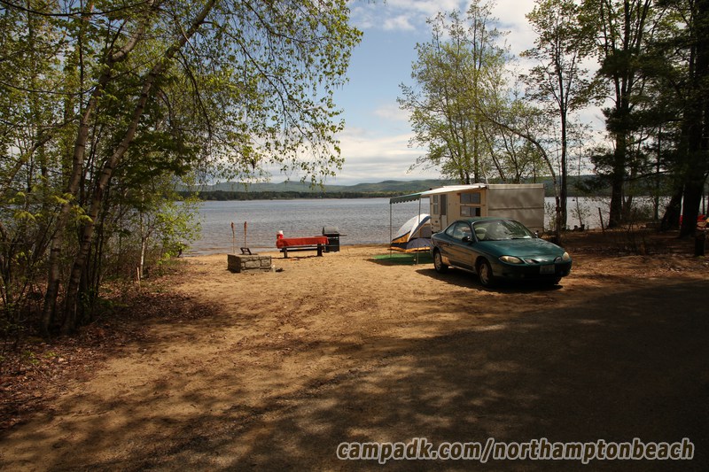 Campsite Photo of Site 110 at Northampton Beach Campground, New York - Looking at Site from Road Sign Visible