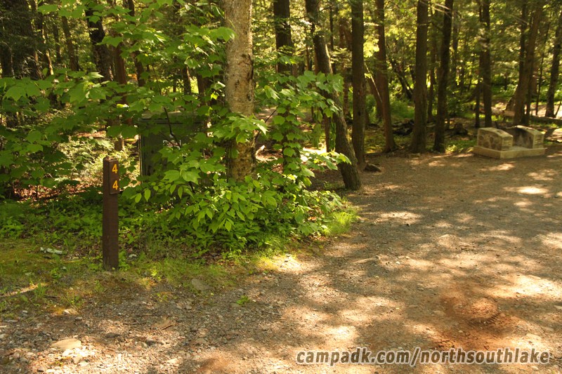 Campsite Photo of Site 44 at North South Lake Campground, New York - Looking at Site from Road Sign Visible