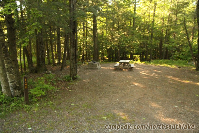 Campsite Photo of Site 120 at North South Lake Campground, New York - Looking at Site from Road Sign Visible