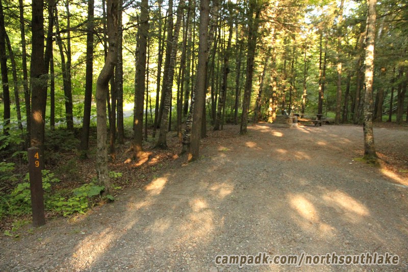 Campsite Photo of Site 49 at North South Lake Campground, New York - Looking at Site from Road Sign Visible