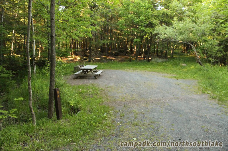 Campsite Photo of Site 84 at North South Lake Campground, New York - Looking at Site from Road Sign Visible