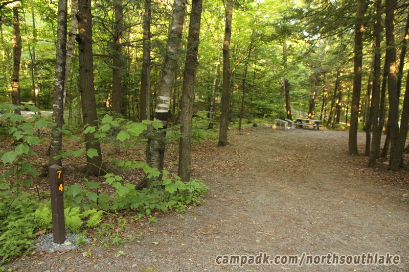 Campsite Photo of Site 74 at North South Lake Campground, New York - Looking at Site from Road Sign Visible