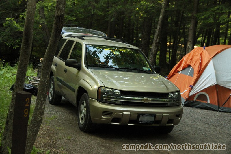 Campsite Photo of Site 29 at North South Lake Campground, New York - Looking at Site from Road Sign Visible