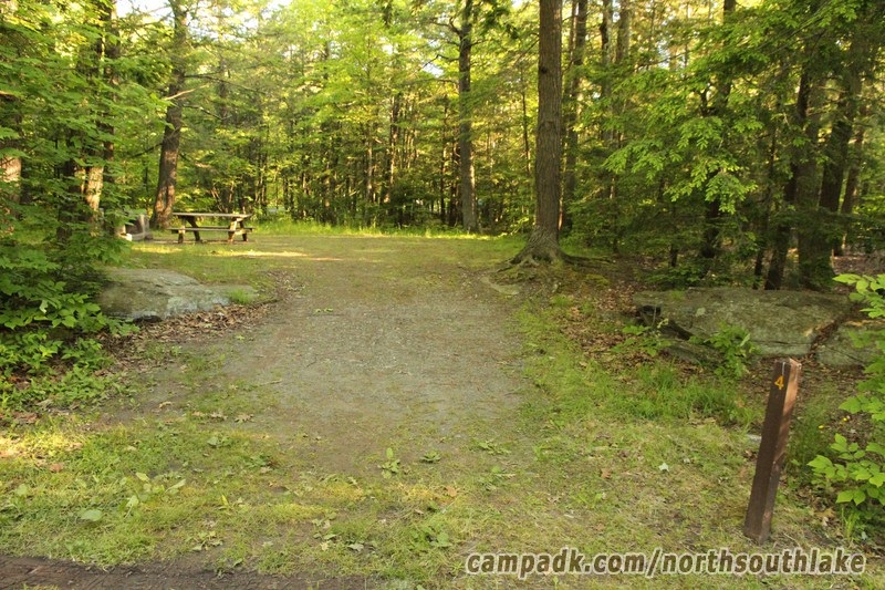 Campsite Photo of Site 4 at North South Lake Campground, New York - Looking at Site from Road Sign Visible