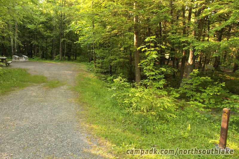 Campsite Photo of Site 24 at North South Lake Campground, New York - Looking at Site from Road Sign Visible