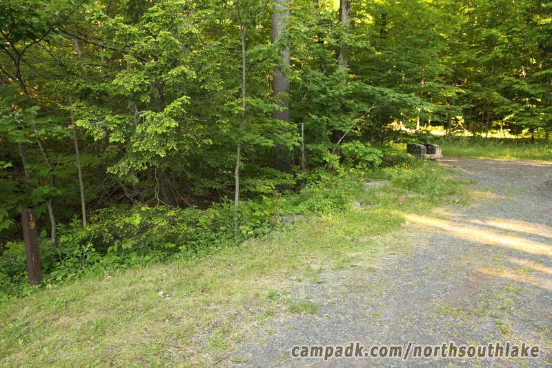 Campsite Photo of Site 19 at North South Lake Campground, New York - Looking at Site from Road Sign Visible
