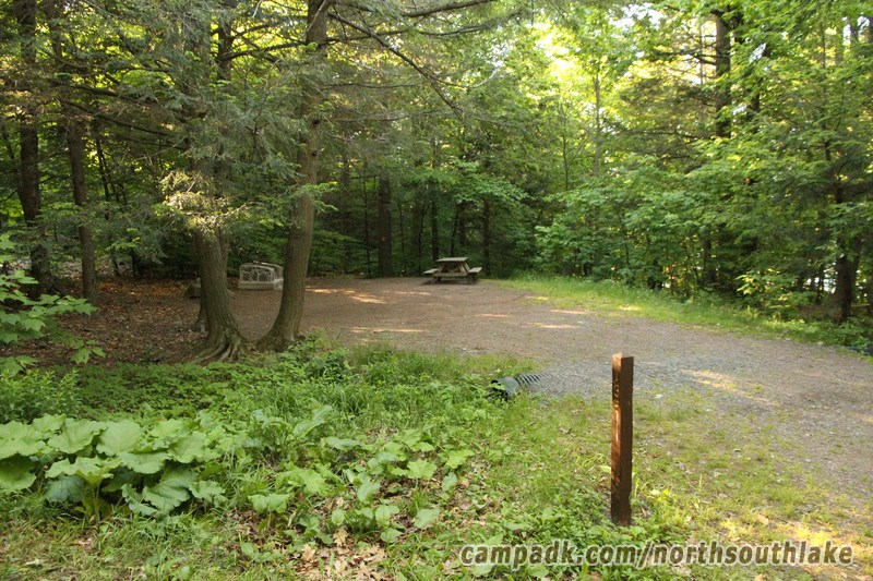 Campsite Photo of Site 135 at North South Lake Campground, New York - Looking at Site from Road Sign Visible
