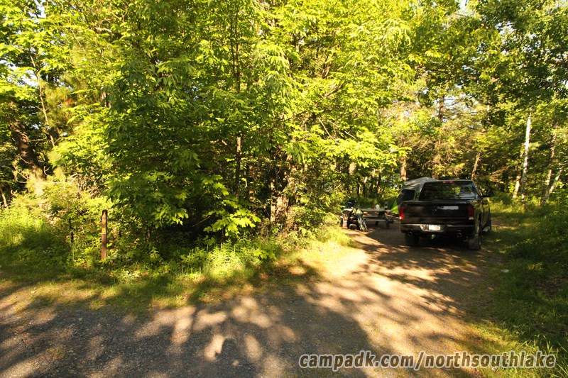 Campsite Photo of Site 170 at North South Lake Campground, New York - Looking at Site from Road Sign Visible