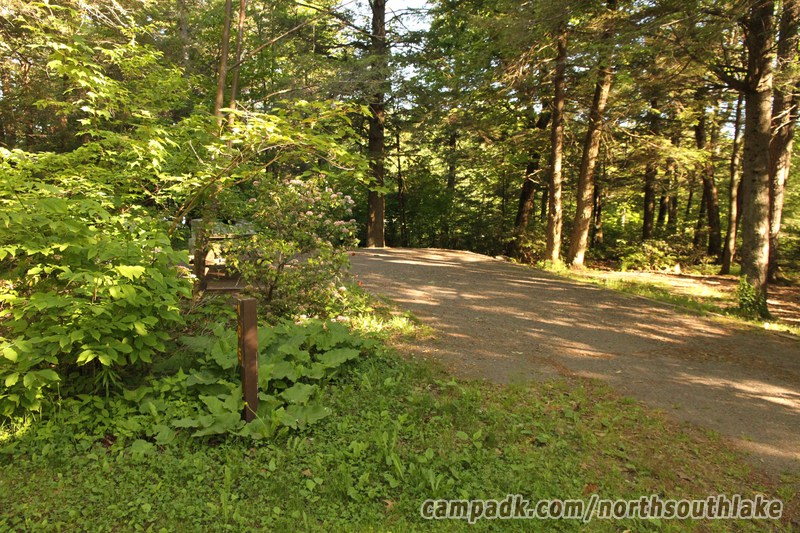 Campsite Photo of Site 185 at North South Lake Campground, New York - Looking at Site from Road Sign Visible