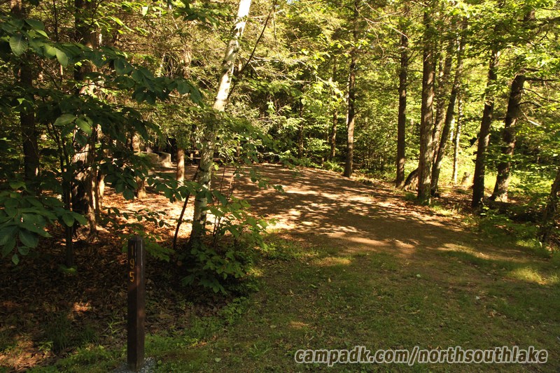 Campsite Photo of Site 195 at North South Lake Campground, New York - Looking at Site from Road Sign Visible