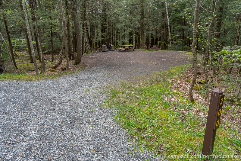 Campsite Photo of Site 200 at North South Lake Campground, New York - Looking at Site from Road Sign Visible