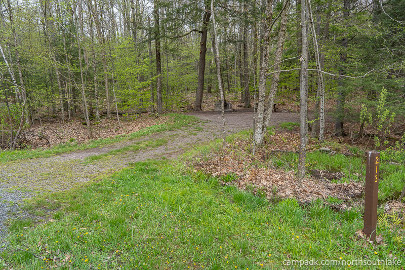 Campsite Photo of Site 213 at North South Lake Campground, New York - Looking at Site from Road Sign Visible