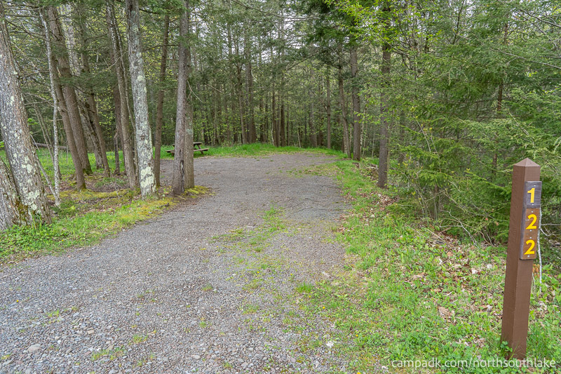 Campsite Photo of Site 122 at North South Lake Campground, New York - Looking at Site from Road Sign Visible